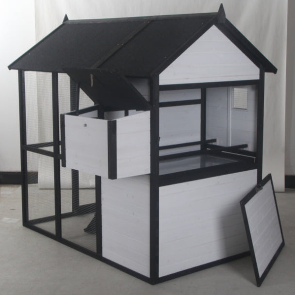 New Urban Northern Coops farmhouse coops wooden chicken coop with a white exterior, black trim and black roof