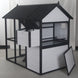 New Urban Northern Coops farmhouse coops wooden chicken coop with a white exterior, black trim and black roof